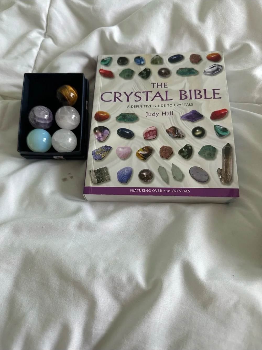 The Crystal Bible with Assorted Crystal Spheres - Purple, White, Blue, Brown